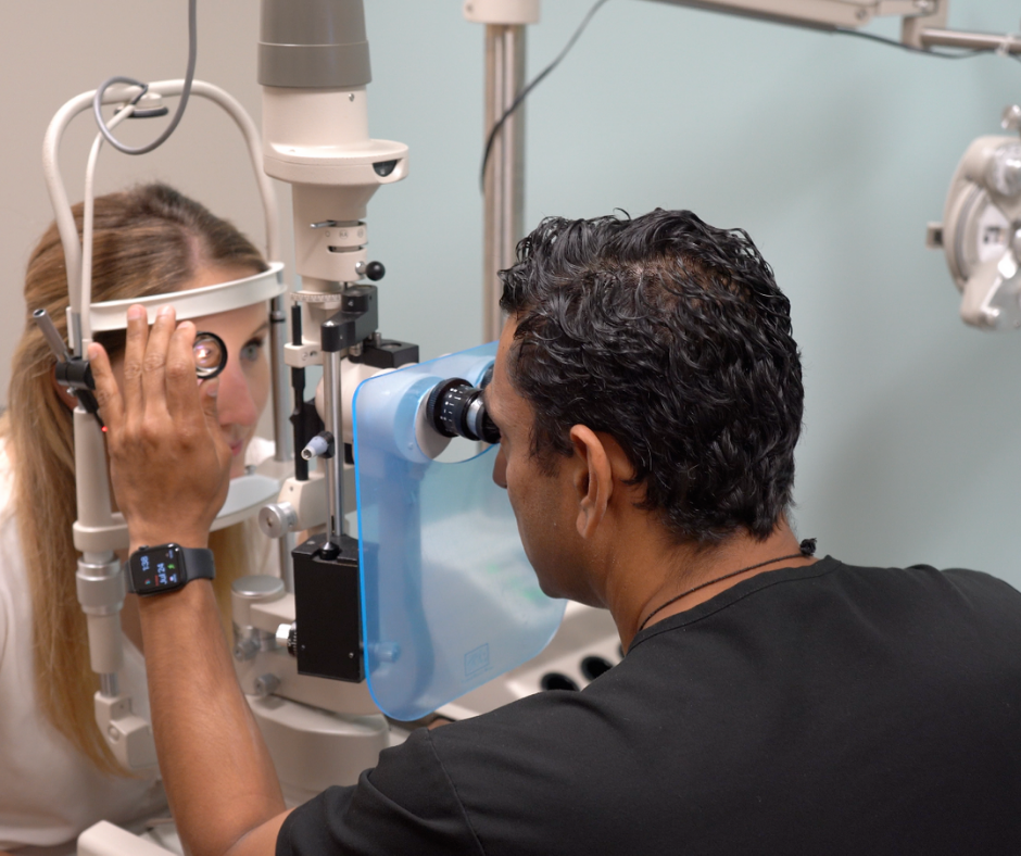 Chirag J. Patel, MD, FACS performing eye exam on patient